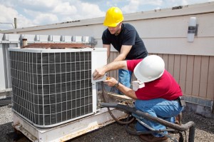 Technicians fixing ac unit