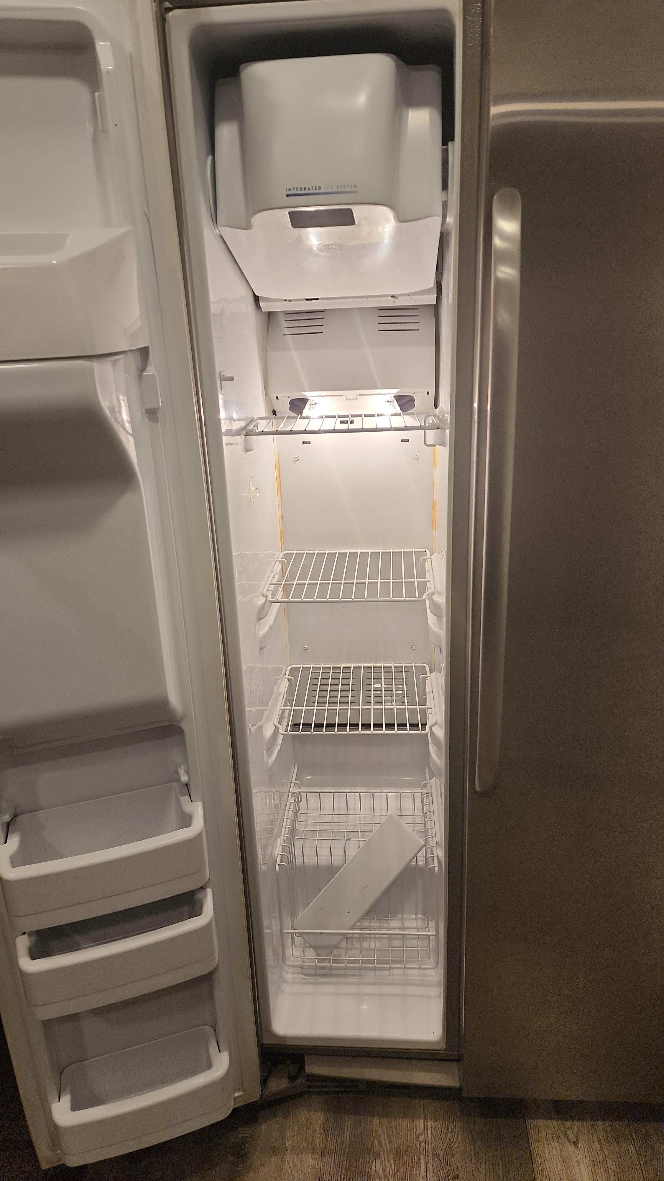 Interior freezer compartment of GE side-by-side refrigerator during defrost diagnosis in Margate FL RR0099