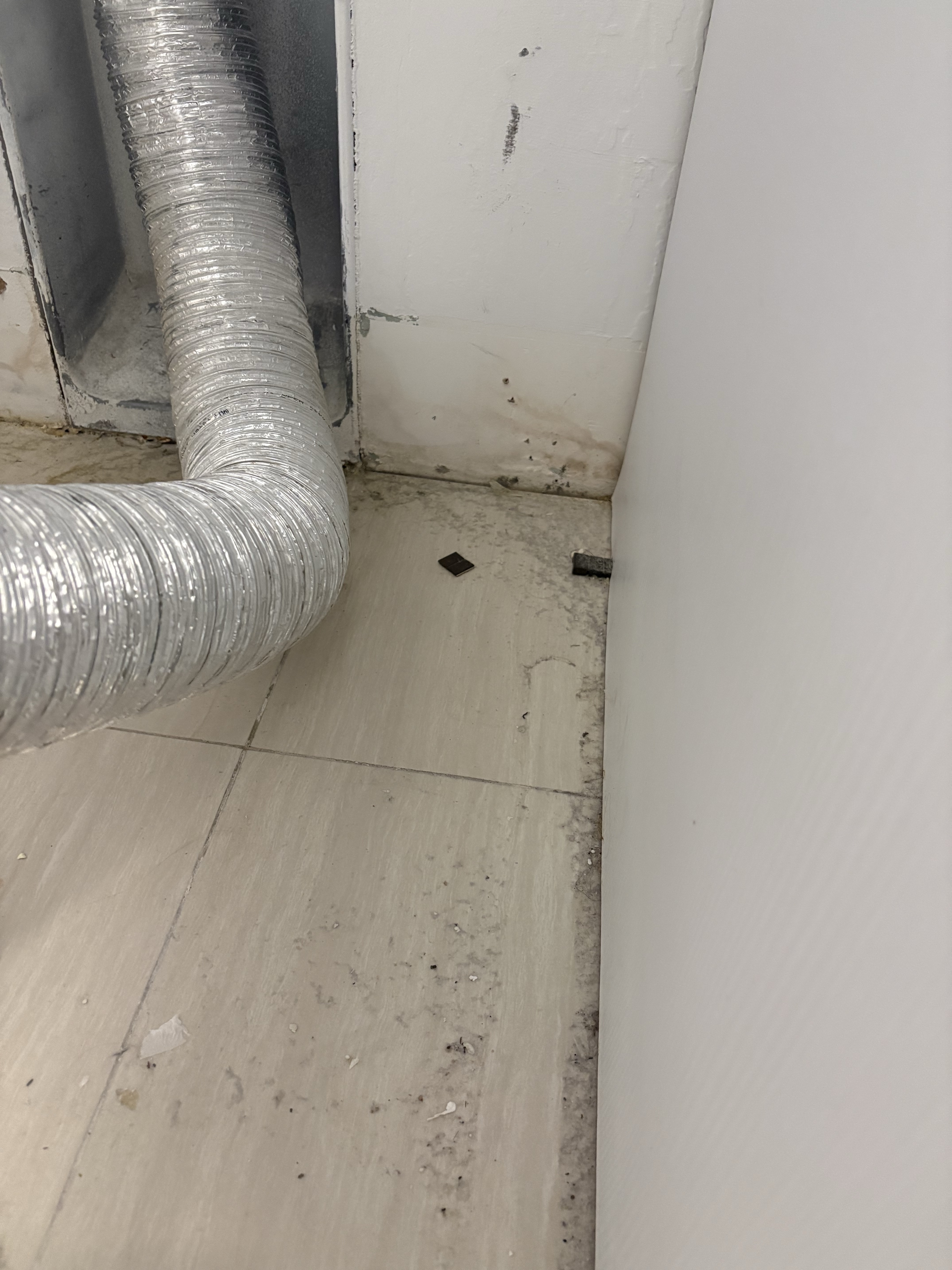 GE washing machine inspected for possible leak in Boca Raton FL RR0065, showing stacked washer and dryer in closet.