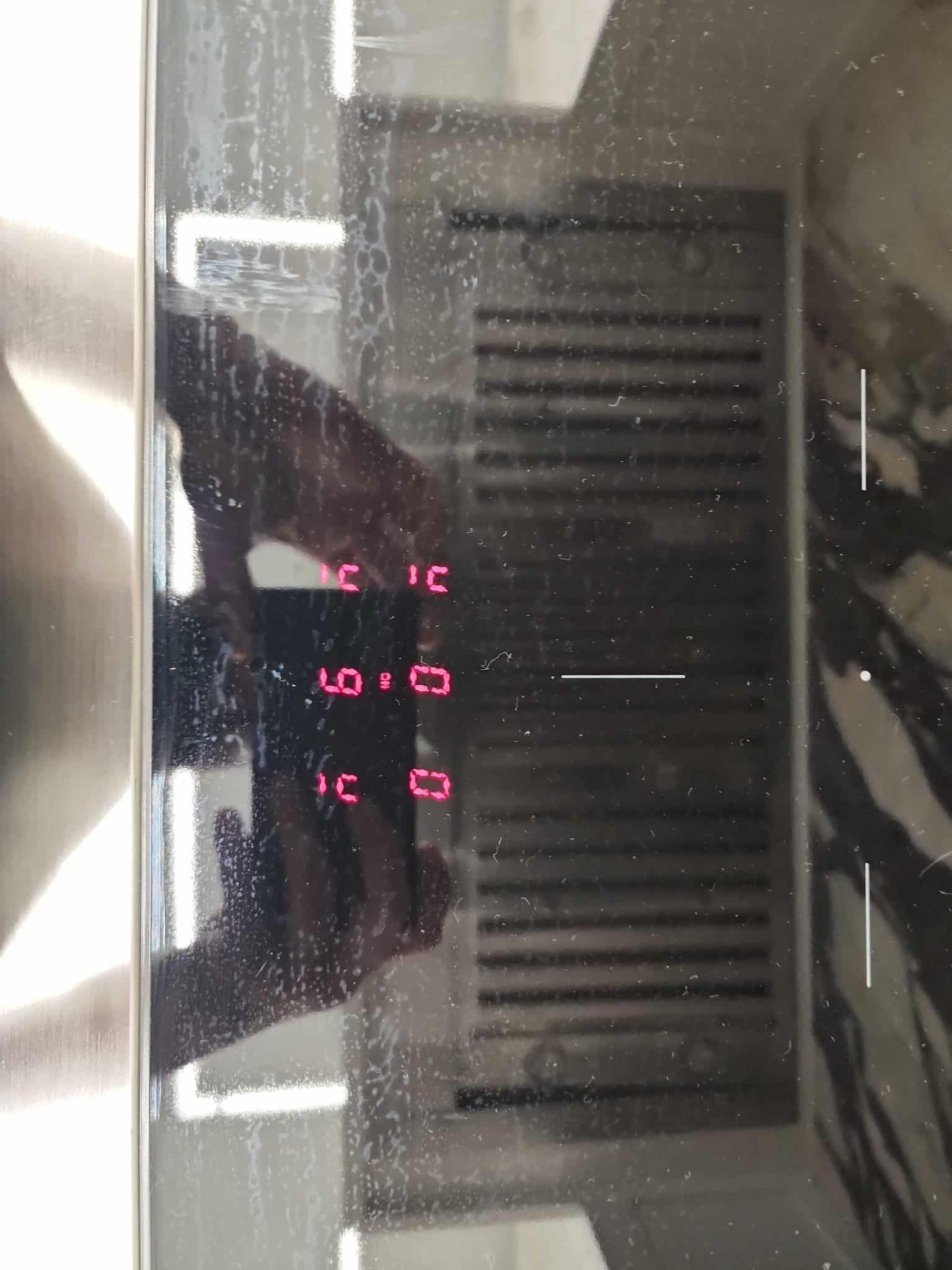 Close-up of an ILVE range digital display showing a red E9 error code during a diagnostic service call in Miramar, Florida.