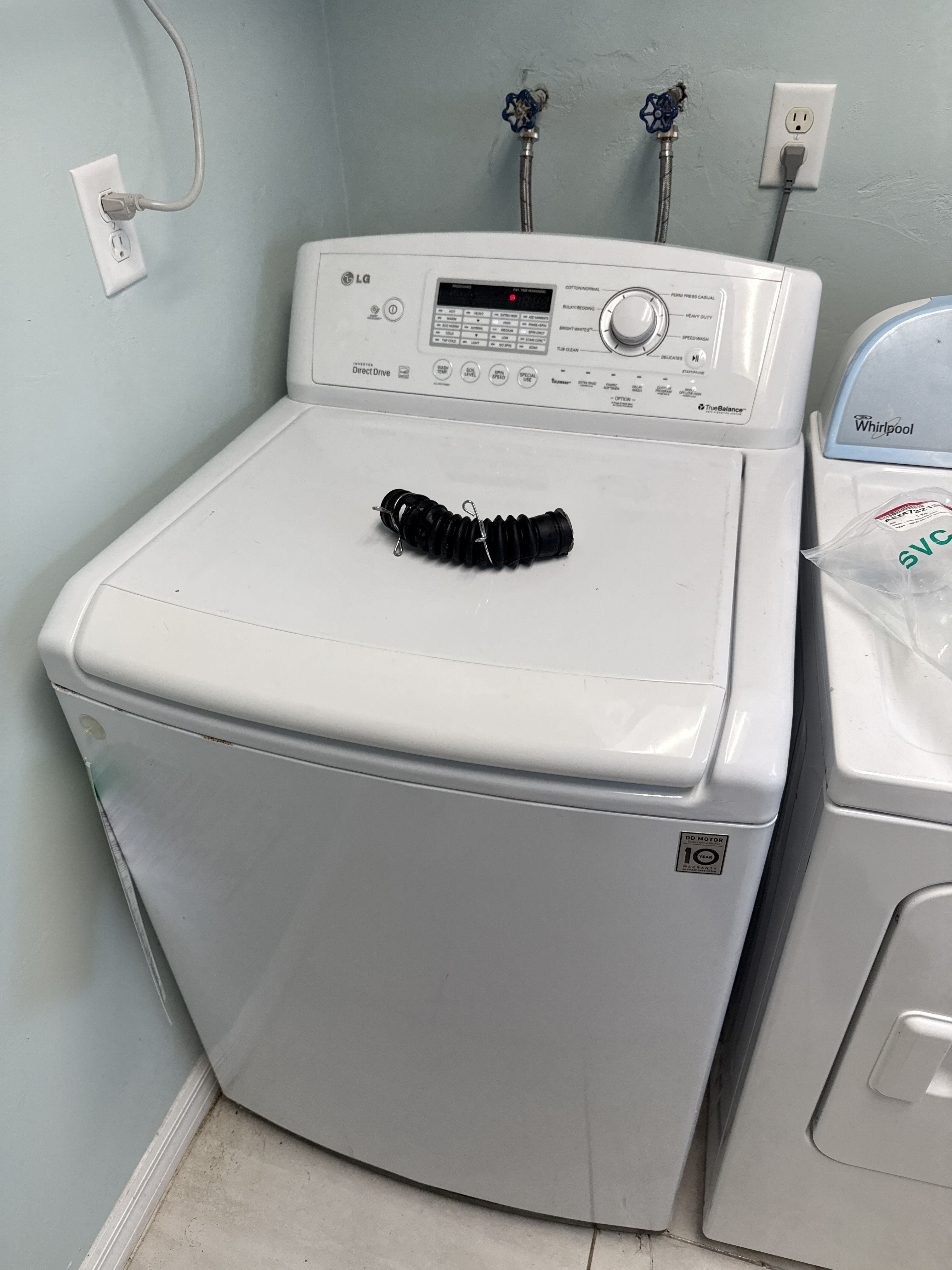 LG WT4870CW top-load washer during drain hose replacement service in Oakland Park FL RR0095