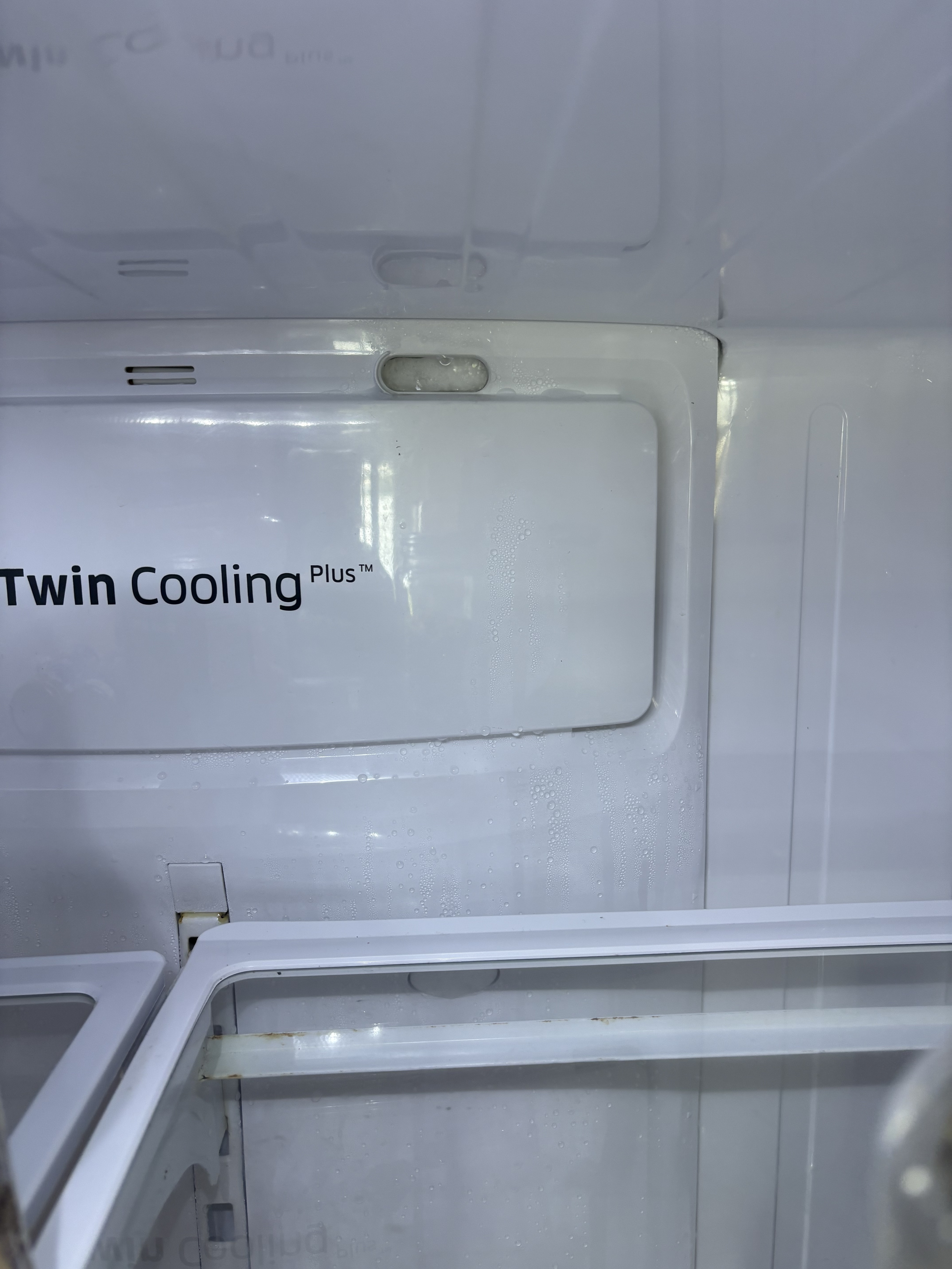 Interior of Samsung refrigerator showing fresh food section water leak and defrost issue in Deerfield Beach FL RR0103