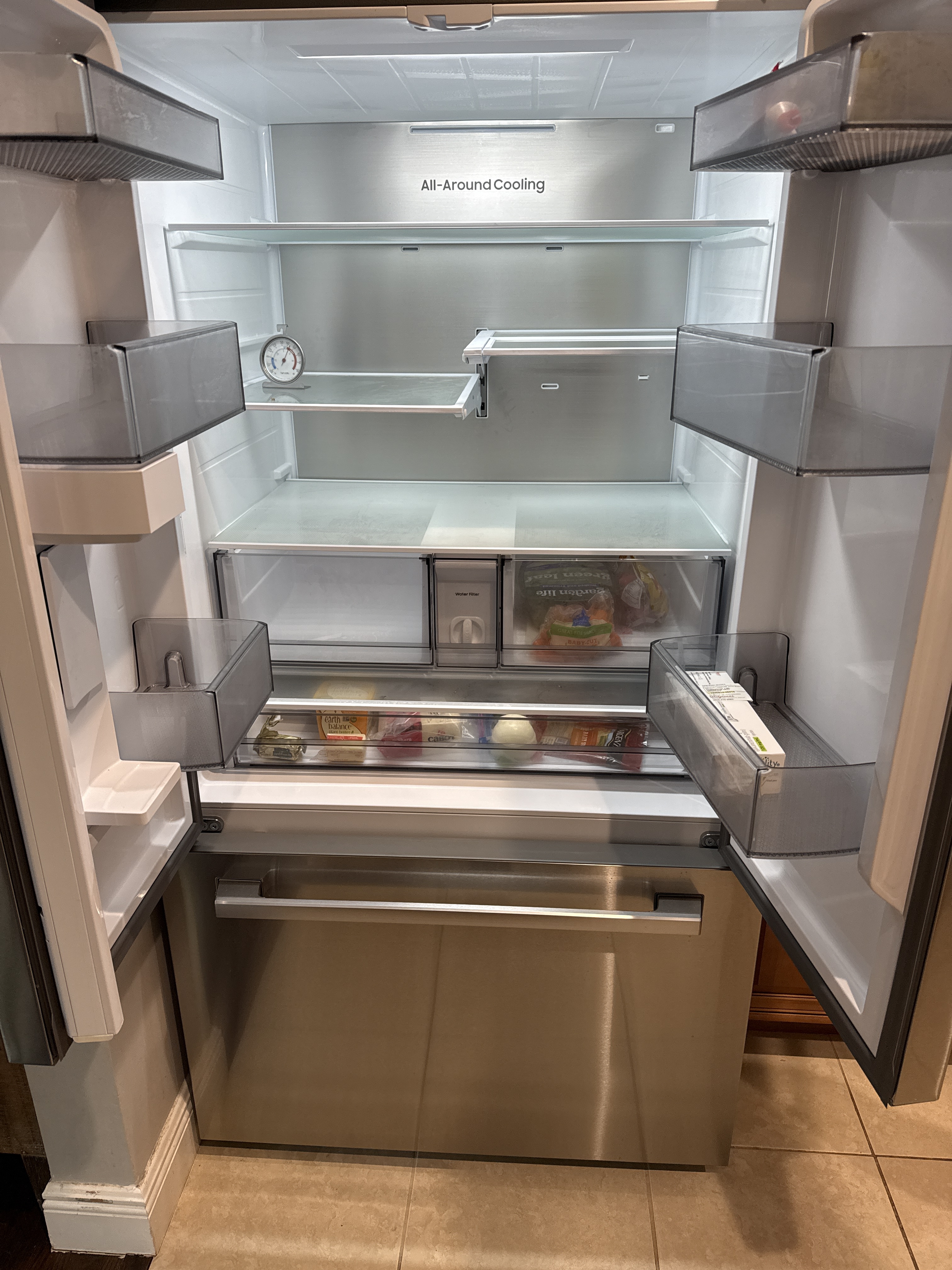 Samsung refrigerator interior with open doors during water line service in Margate FL RR0083