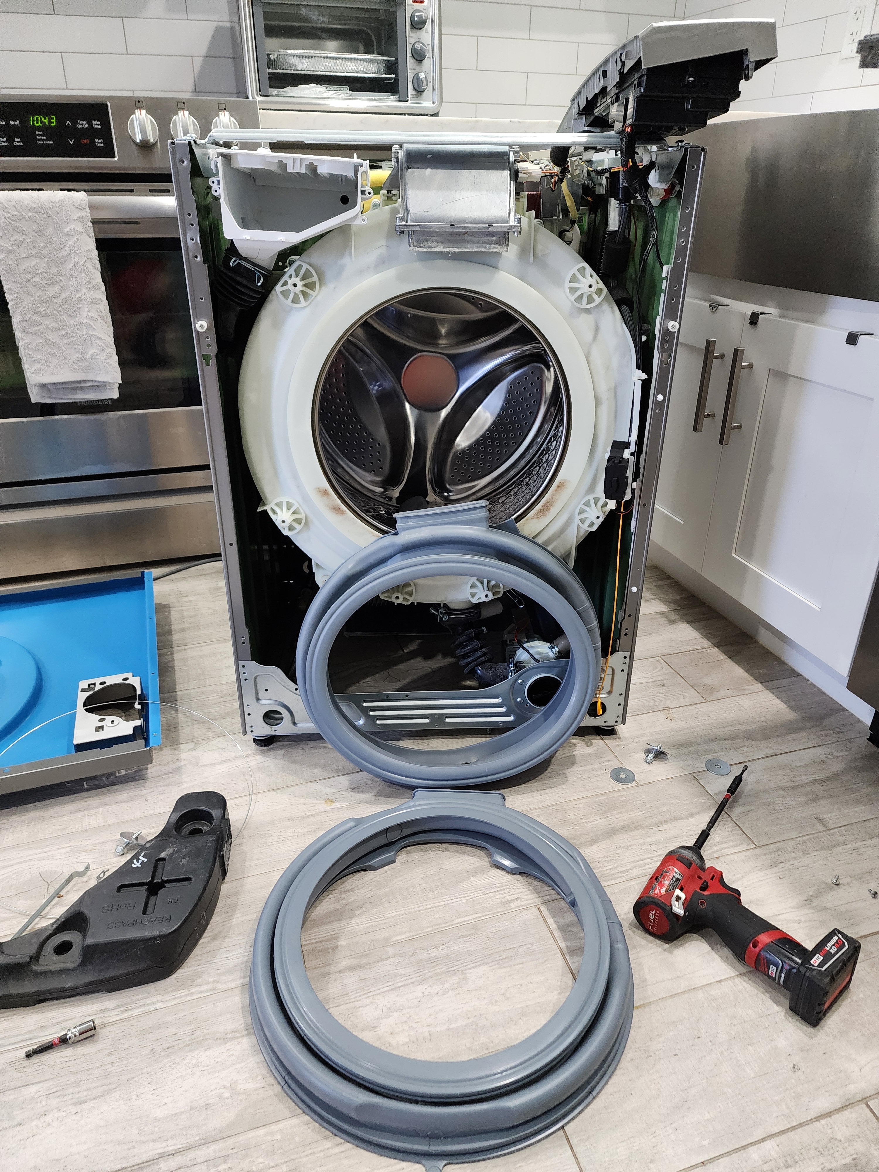 New replacement door gasket next to the removed bad gasket during Summit washer repair RR0101