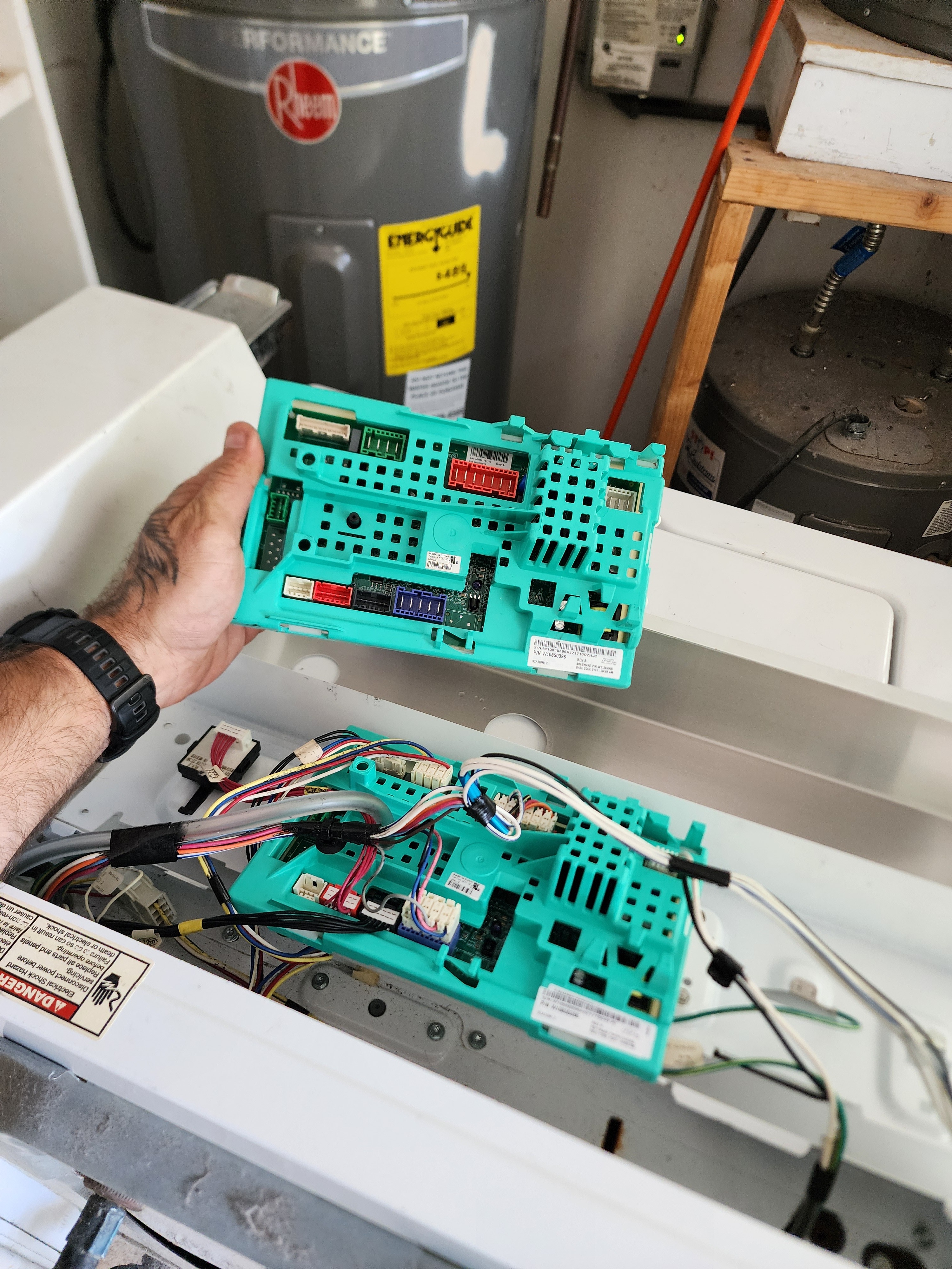 Technician replacing the main control board on a Whirlpool commercial washer in Lauderdale-by-the-Sea FL RR0052