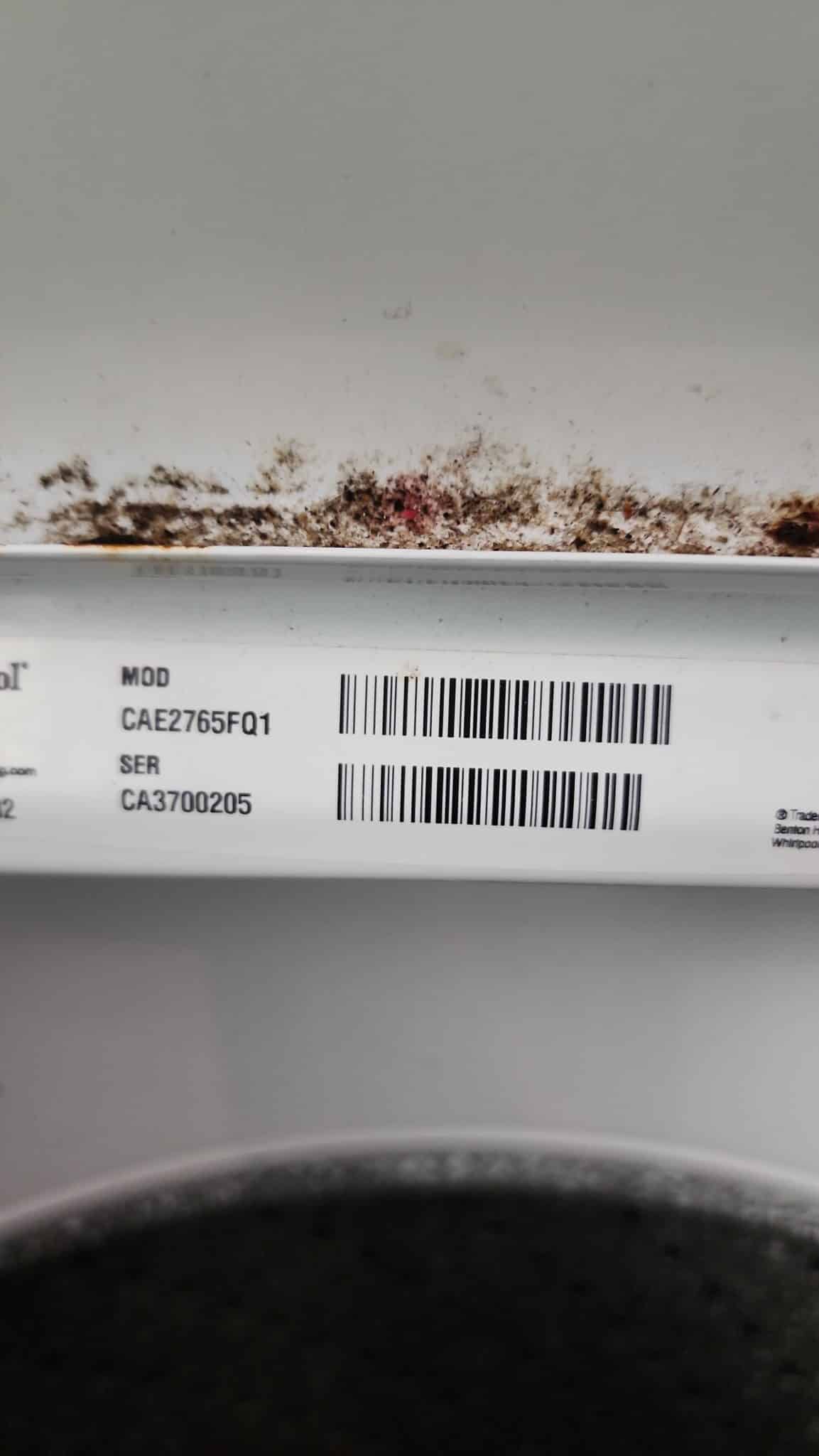 Whirlpool CAE2765FQ1 commercial washer model identification photographed during repair in Lauderdale-by-the-Sea FL