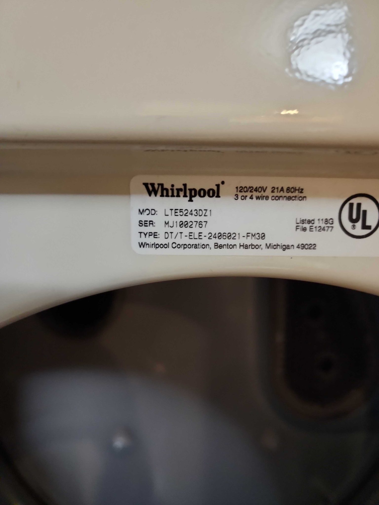 Manufacturer specification sticker for a Whirlpool laundry center showing model number LTE5243DZ1 and serial number MJ1002767.